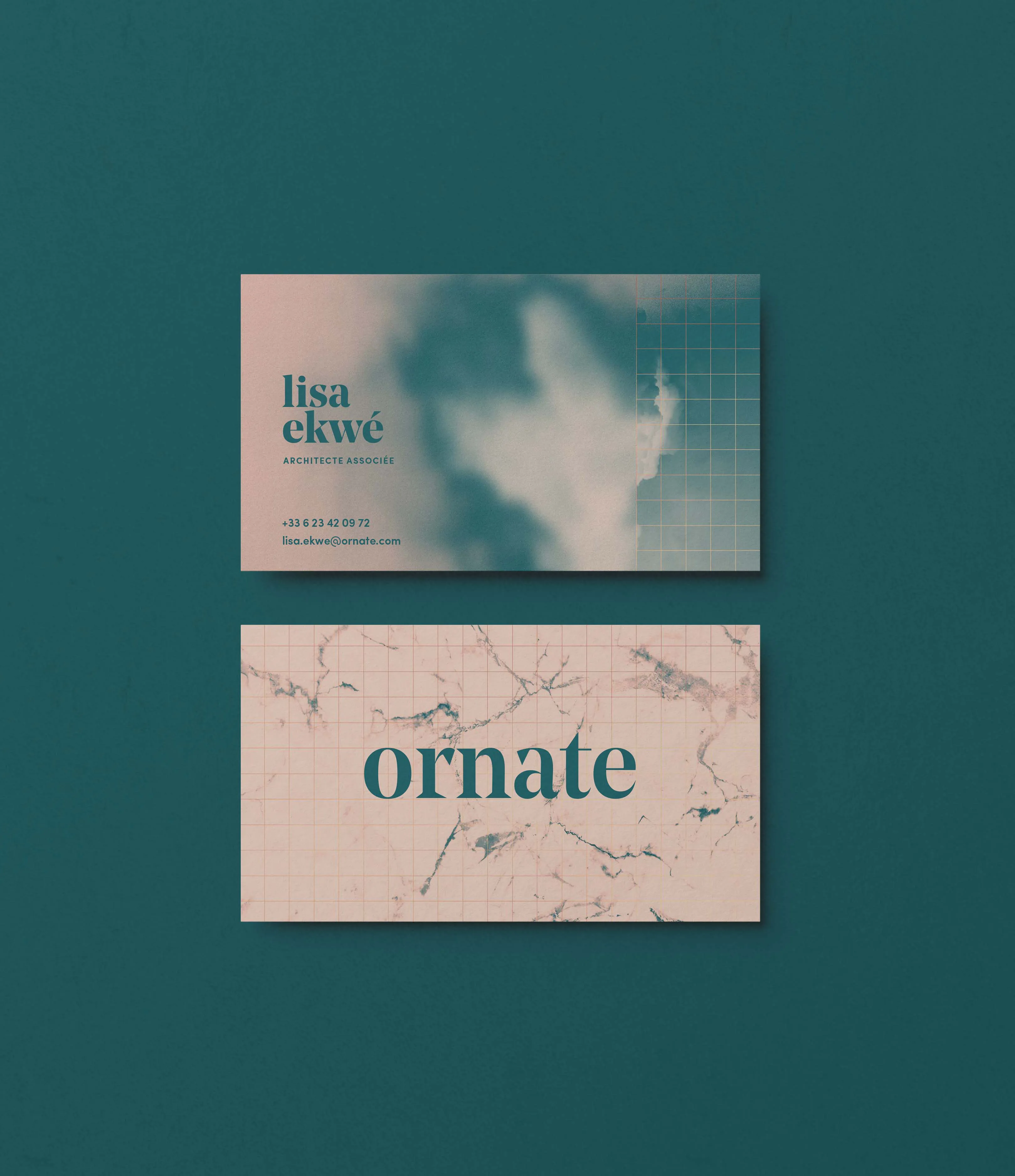 Ornate business cards showcasing the studio’s colors, typography and visual identity.